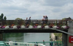 Flowered bridge on the river Marne